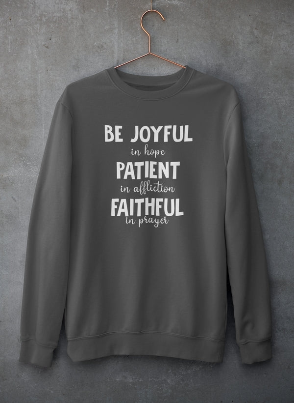 Gray sweatshirt with motivational text on a gray background