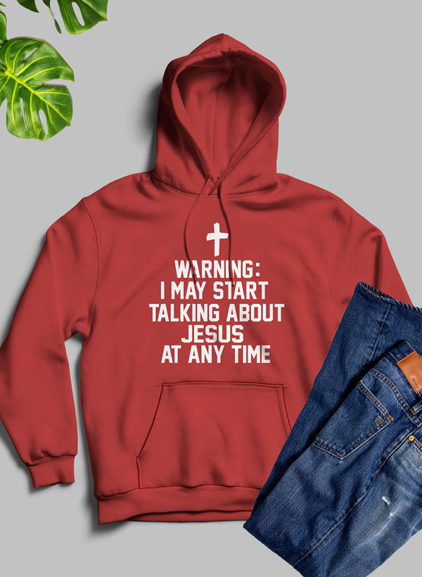 Red hoodie with text and a cross, paired with blue jeans on a gray background.