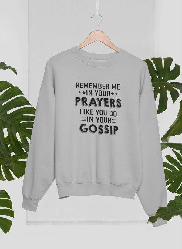 Gray sweatshirt with humorous text on a hanger against a white background with green leaves.