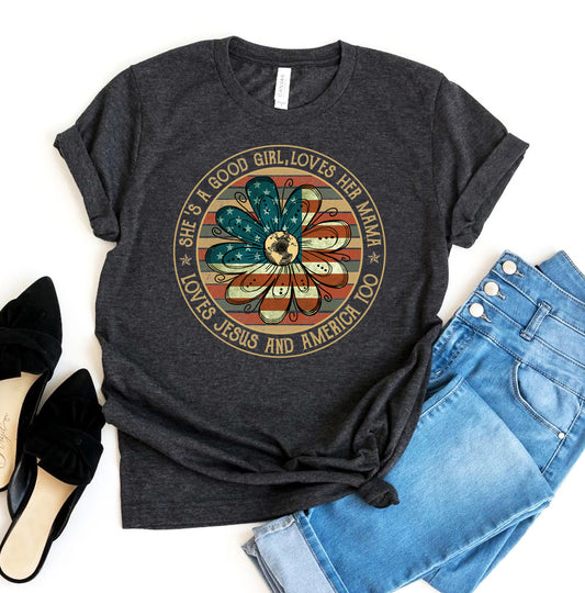 Dark gray t-shirt with a graphic design and text, paired with jeans and shoes on a white background